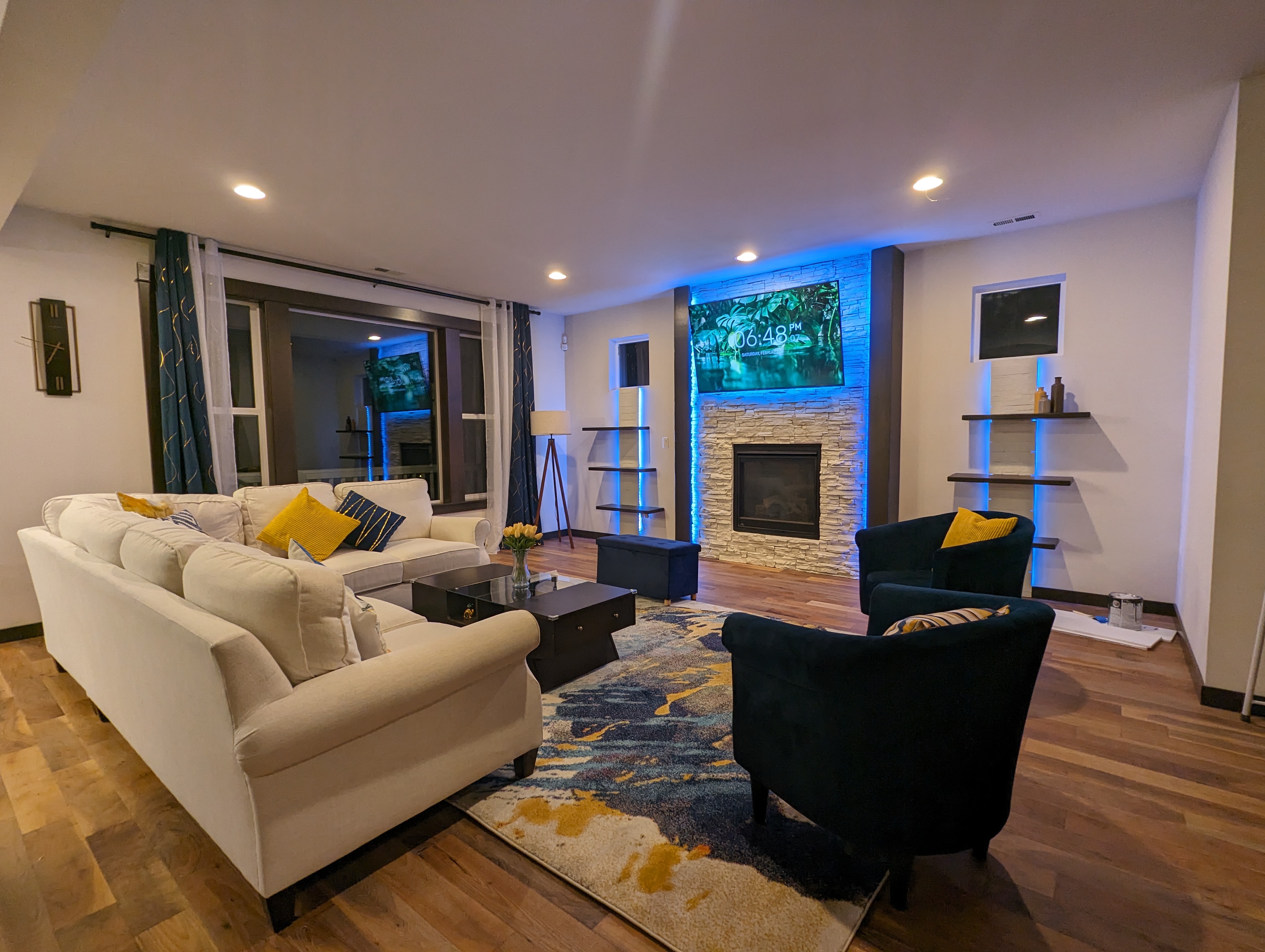 Custom shelving and frame accentuating the fireplace feature