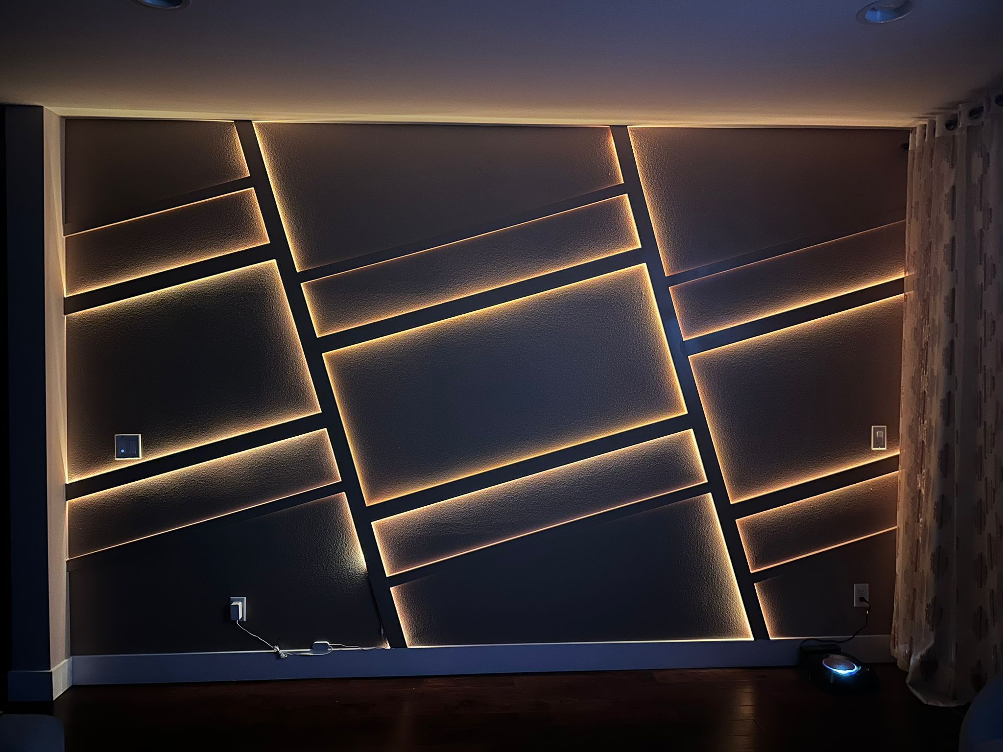 Texture and lighting come together to make this unique and striking accent wall