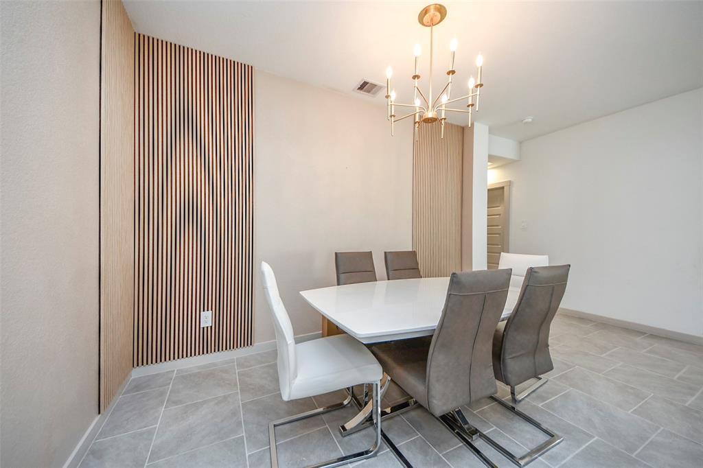 Classic wood slats uplift this Dining room from basic to Chic